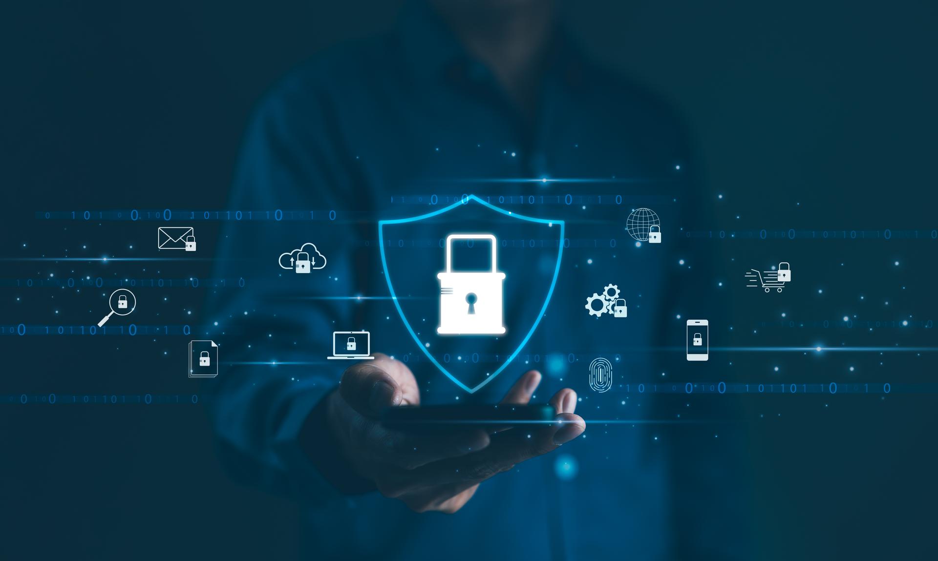 Cybersecurity Concept. A person holds a smartphone displaying a shield with a lock symbol, surrounded by various cyber security icons, representing user privacy, and data encryption. Secure technology